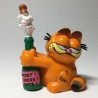 GARFIELD OPENING CHAMPAGNE BOTTLE. FIGURE PVC 6 cm. BULLY WEST GERMANY 1978, 1981