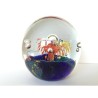 SPHERICAL GLASS PAPERWEIGHT WITH MULTICOLOR FLOWER AND BUBBLES DESIGN.