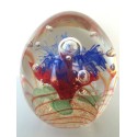 OVAL GLASS PAPERWEIGHT WITH MULTICOLORED FLOWER AND CONTROLLED BUBBLES
