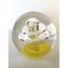 SPHERICAL GLASS PAPERWEIGHT:  YELLOW FLOWER WITH SMALL BUBBLES AND BIG CENTRAL SPIRAL