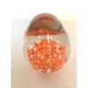 OVOID EGG GLASS PAPERWEIGHT WITH ORANGE AND WHITE EGG INSIDE